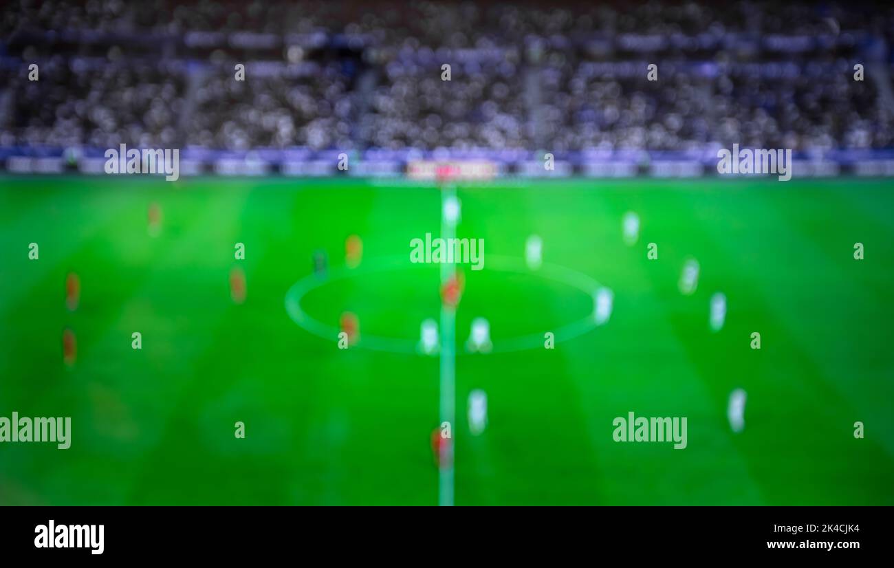 Blurry fooSoccer arena with blur on game day. Crowd watching football