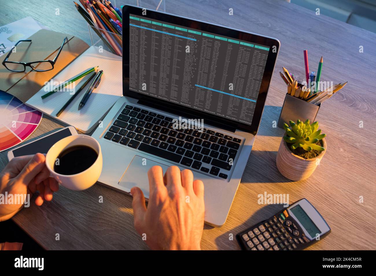 Hands of caucasian male programmer sitting at desk and using laptop ...