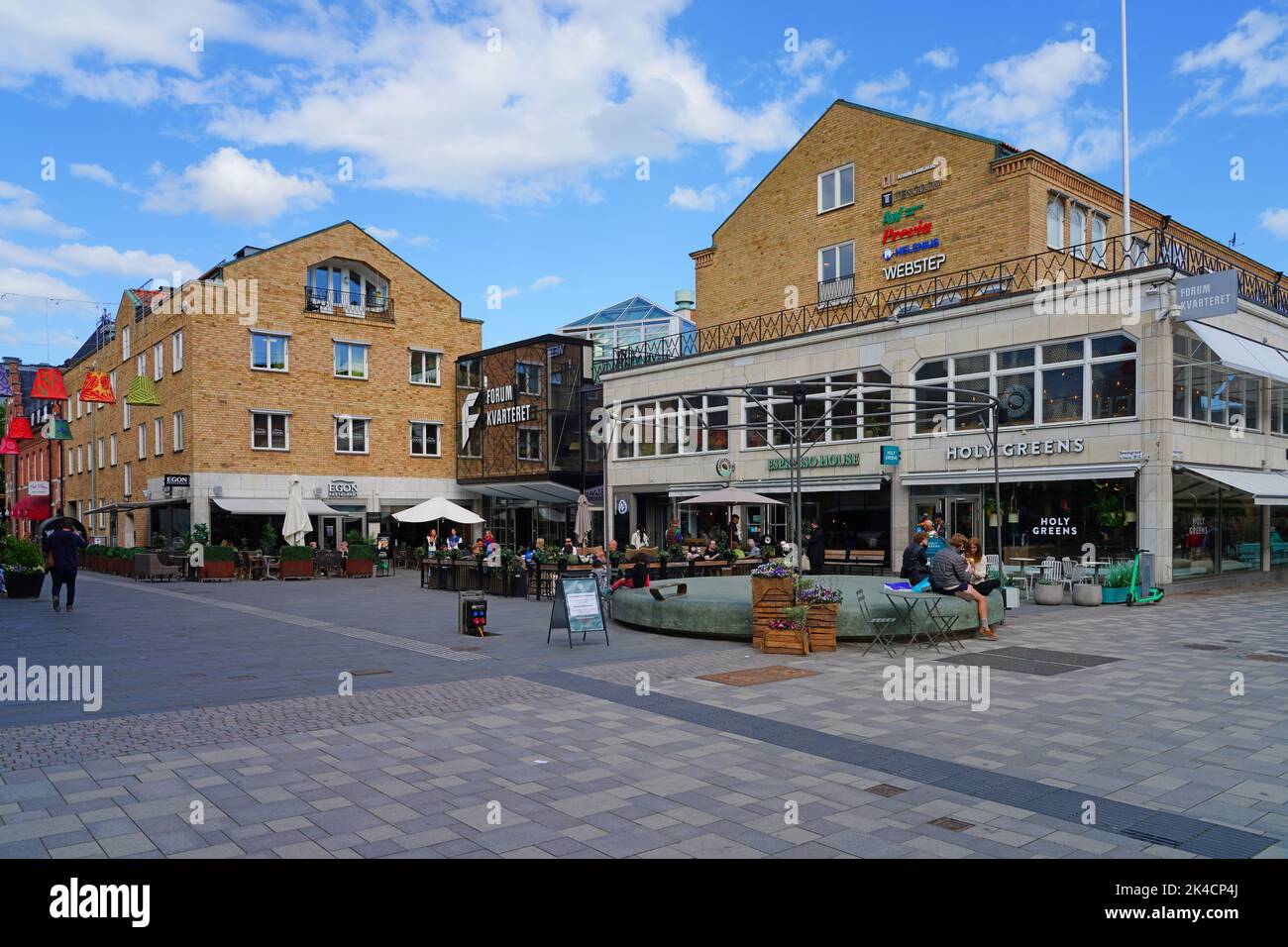 UPPSALA, SWEDEN -1 JUN 2022- View of buildings on the street in downtown Uppsala, a university town in Sweden, on the Fyrisan river. Stock Photo