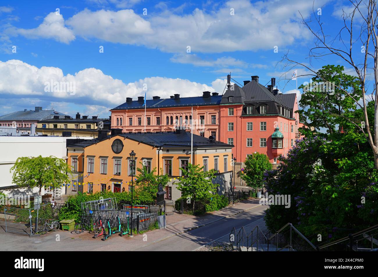 UPPSALA, SWEDEN -1 JUN 2022- View of buildings on the street in downtown Uppsala, a university town in Sweden, on the Fyrisan river. Stock Photo