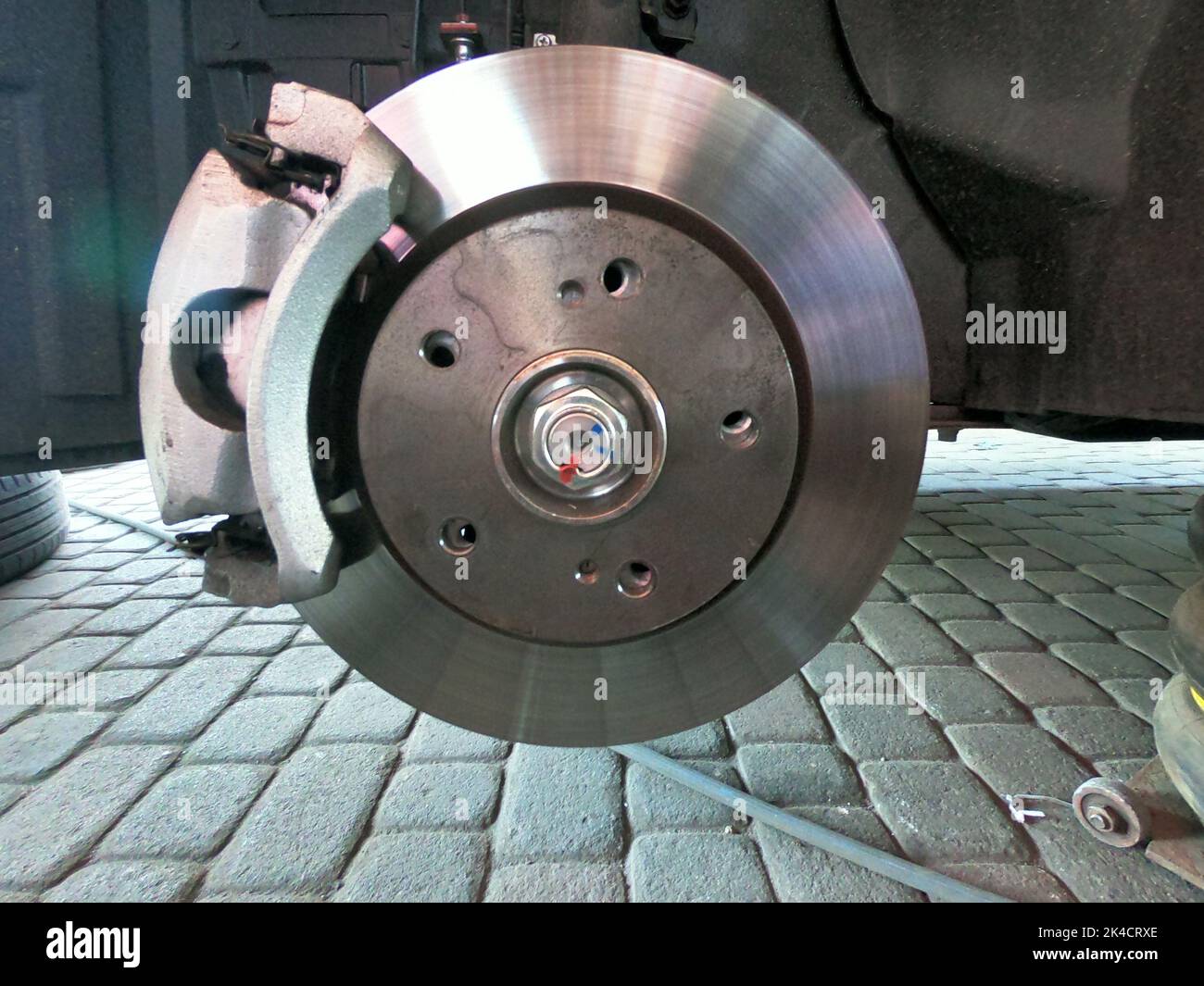 A closeup shot of a car disc brake ready to be fixed Stock Photo