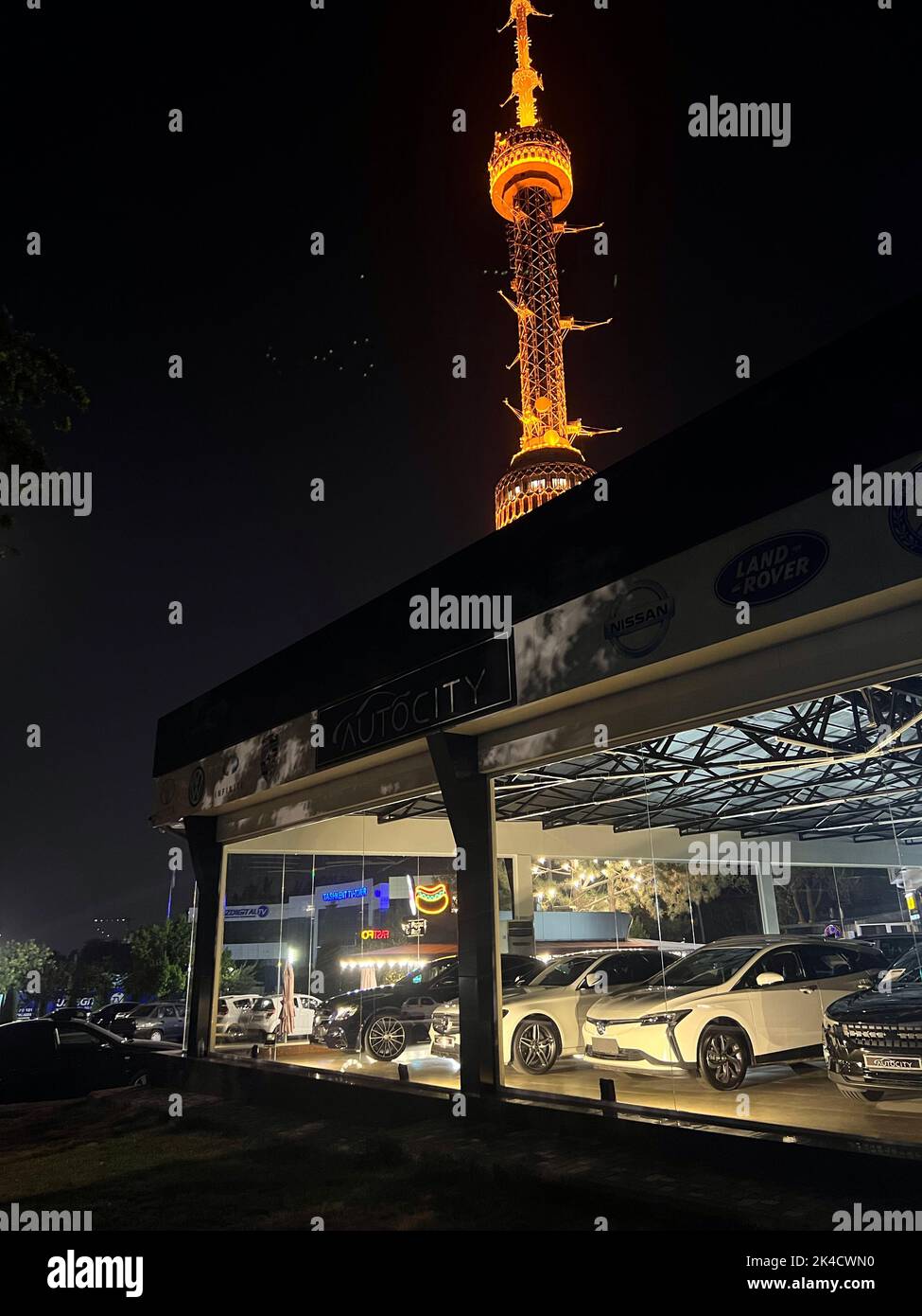 A vertical shot of the Tashkent Television Tower and the most famous cars in Tashkent, Uzbekistan Stock Photo