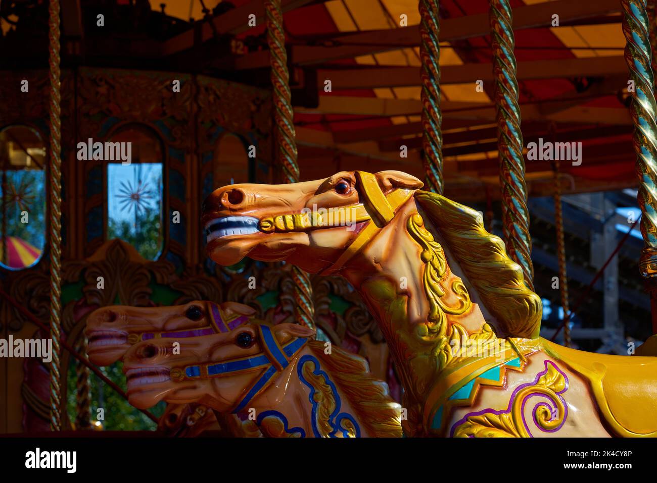 A closeup of a spinning horse carousel captured in the Dreamland
