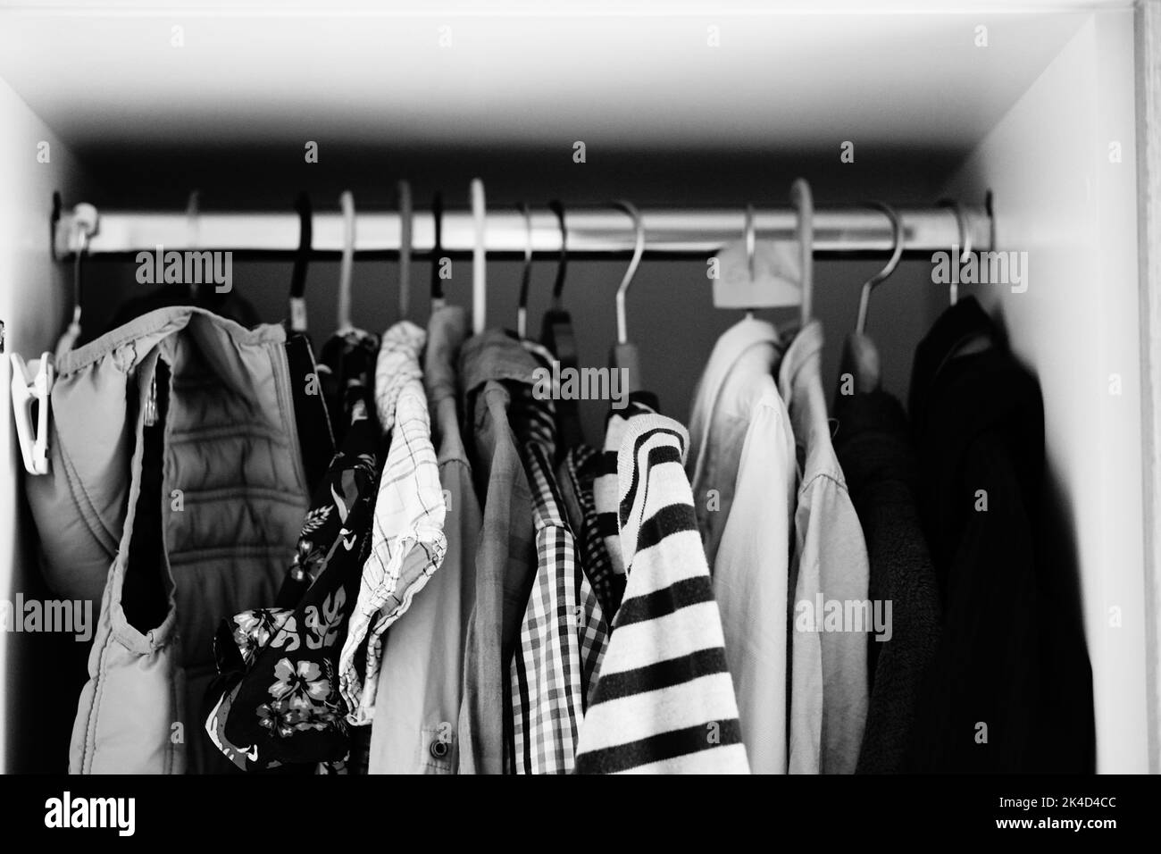 Clothes wardrobe man Black and White Stock Photos & Images - Alamy