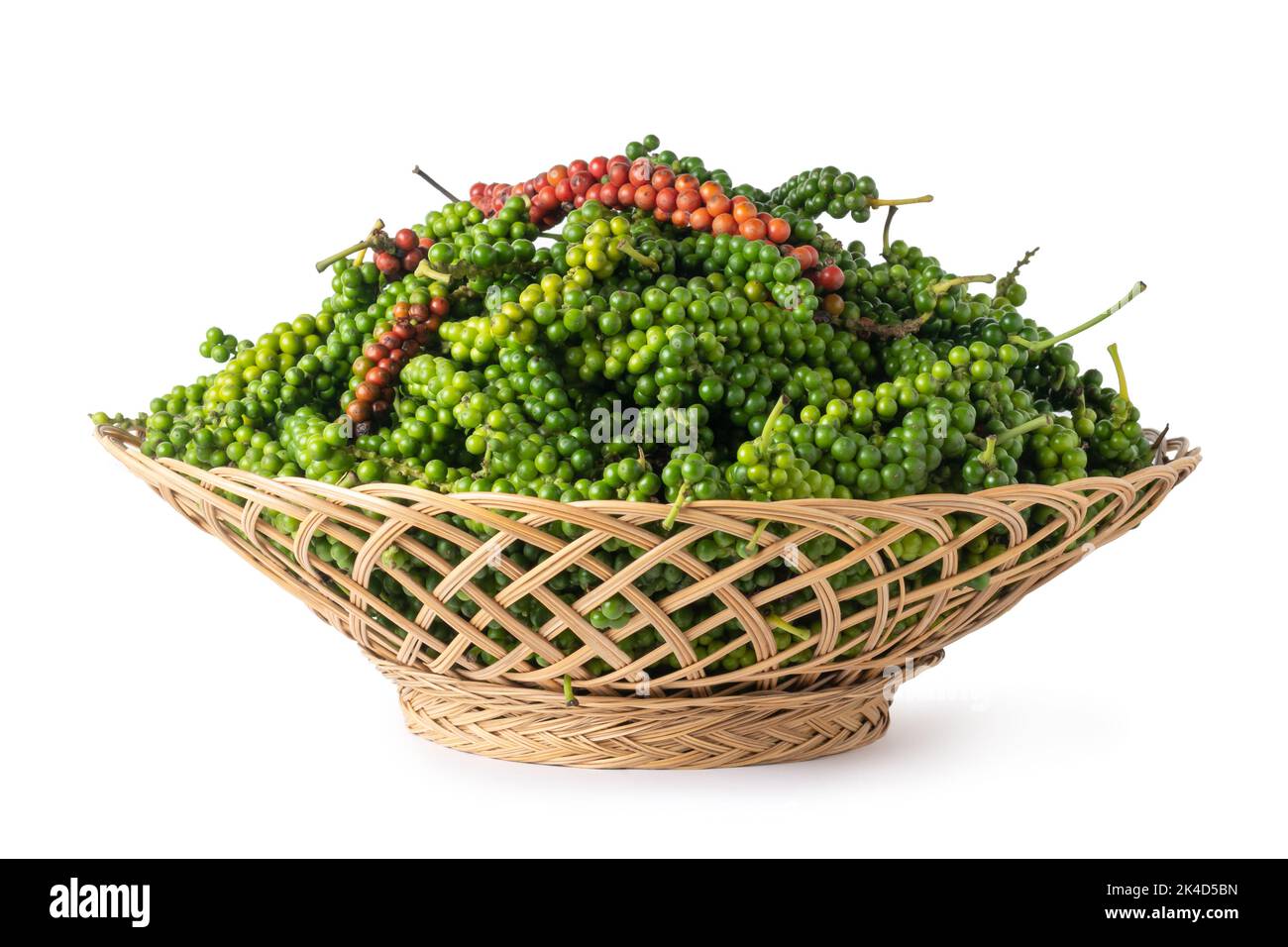 pile of freshly harvested black peppercorns in a basket or container