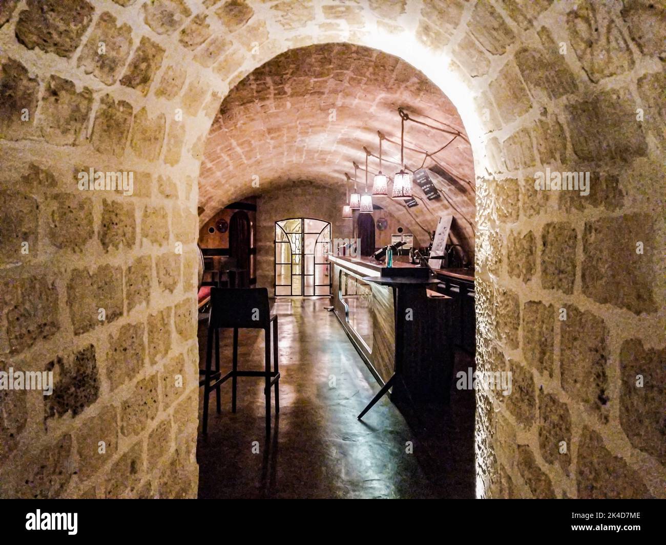 Little corridor leading to a secret bar with highchair and quiet low