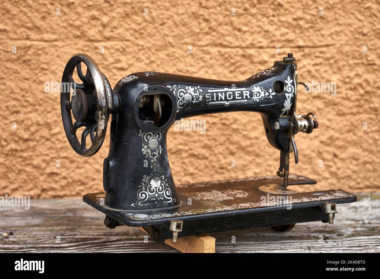 old sewing machine that has seen better times Stock Photo