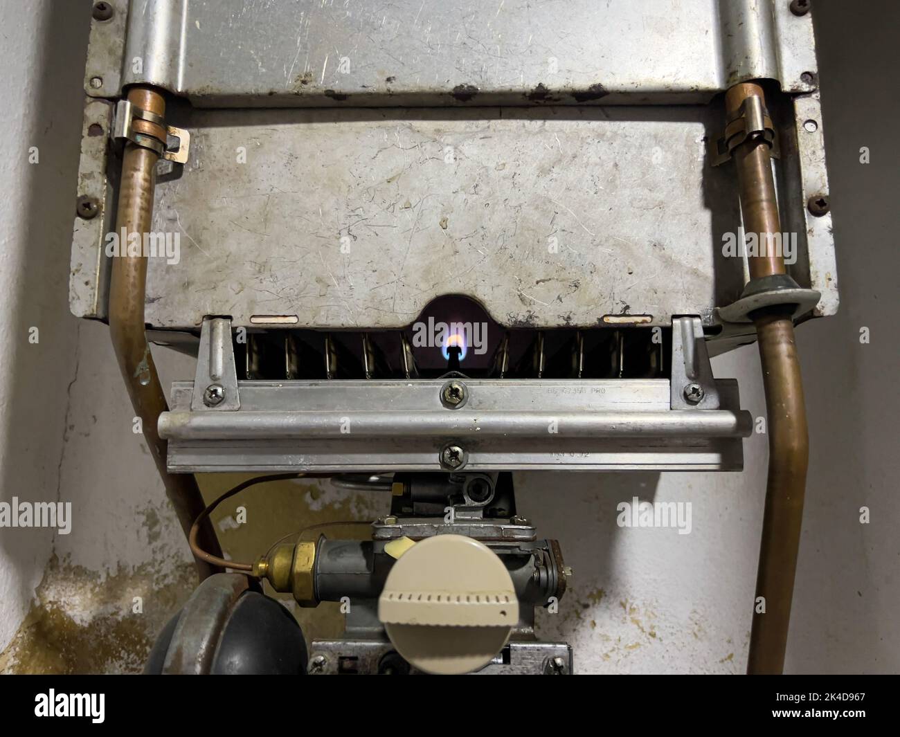 Vintage gas water heater with shower on wall of bricks. Retro Instantaneous water  heater with tap Stock Photo - Alamy