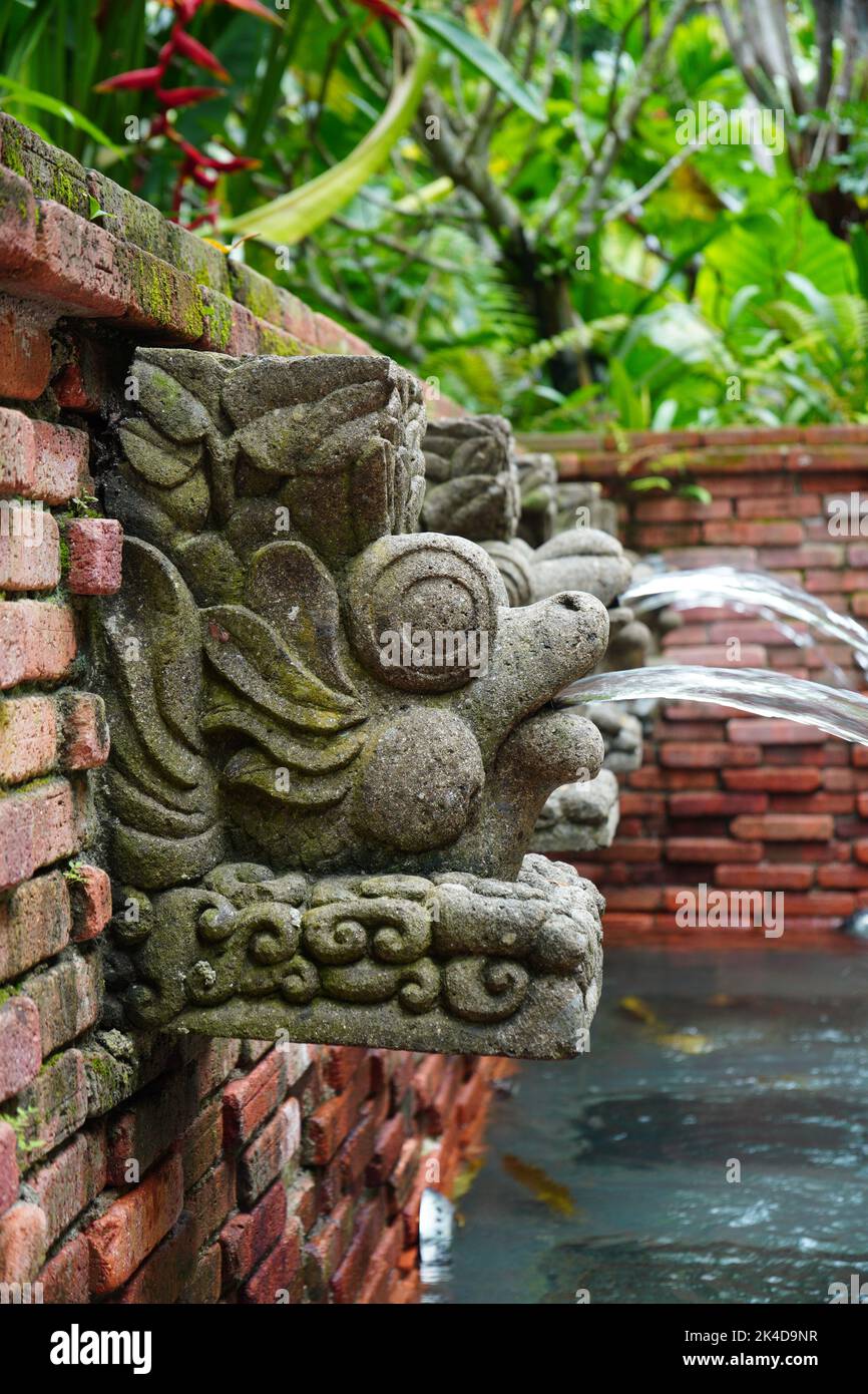 A dragon head water fountain spout Stock Photo