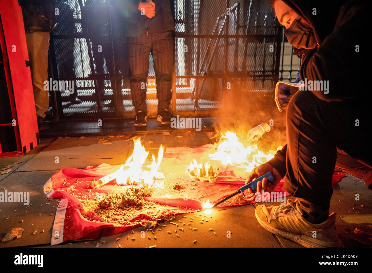 Chinese flag burning hi-res stock photography and images - Alamy
