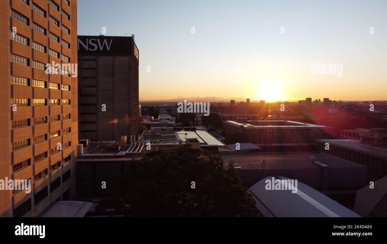 a sunrise over buildings and cityscape Stock Photo - Alamy