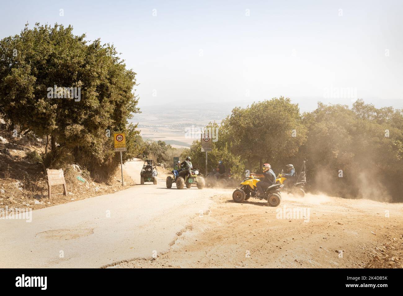group of people riding quad bikes on mount Carmel, Israel Stock Photo ...