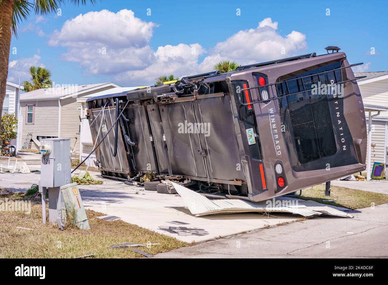 Fort Myers, FL, USA - October 1, 2022: Winnebago rolled over on it's side by strong winds of Hurricane Ian Fort Myers FL Stock Photo