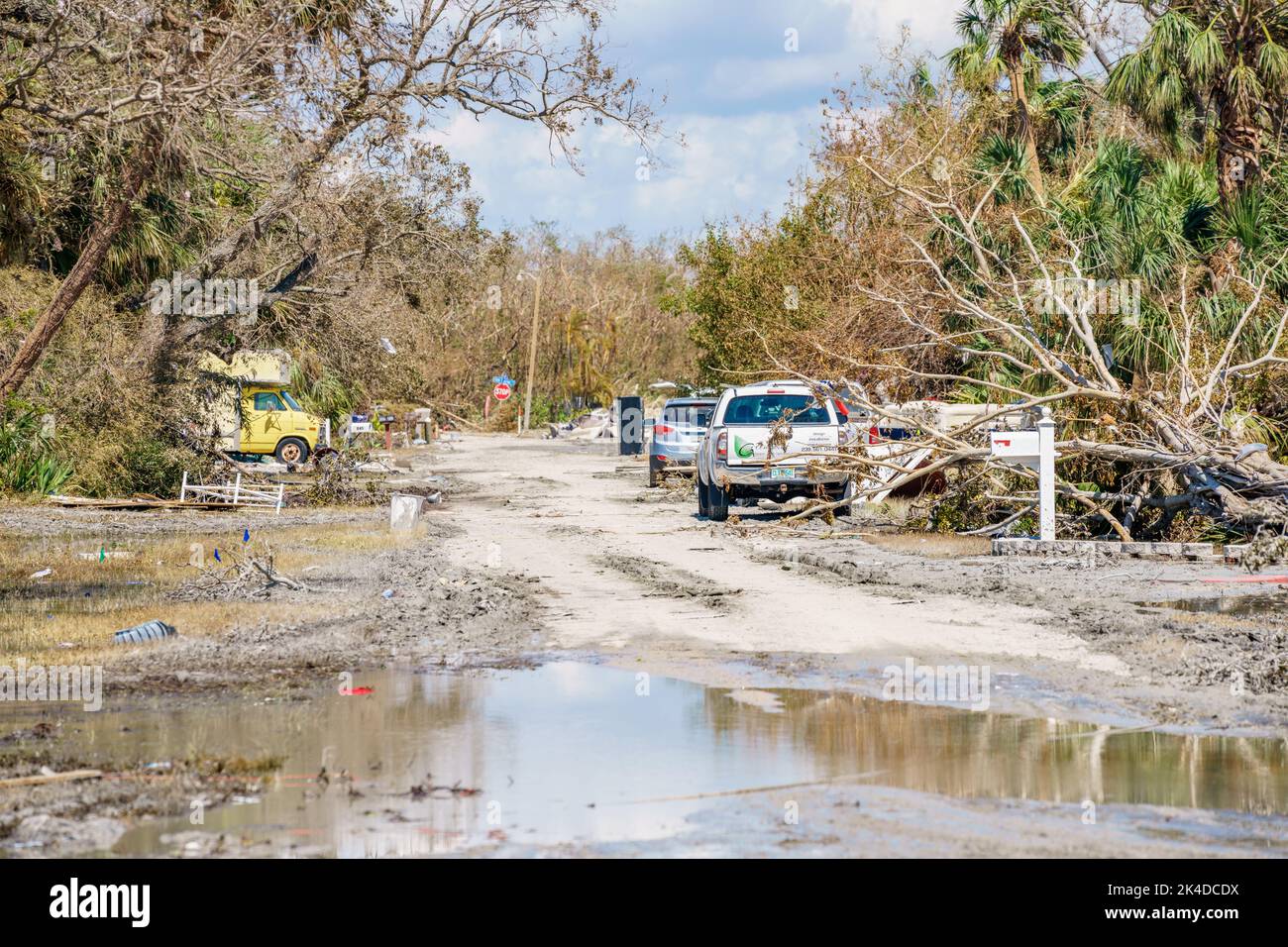 Fort Myers, FL, USA - October 1, 2022: Neighborhoods with salt water and mud on the streets after storm surge from Hurricane Ian Stock Photo