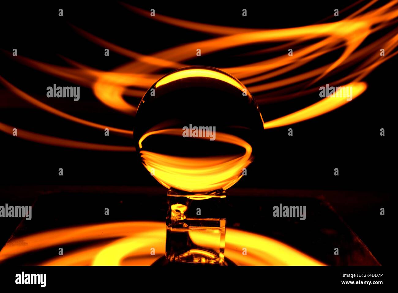 A crystal ball on a small crystal rectangular surface reflecting the ...