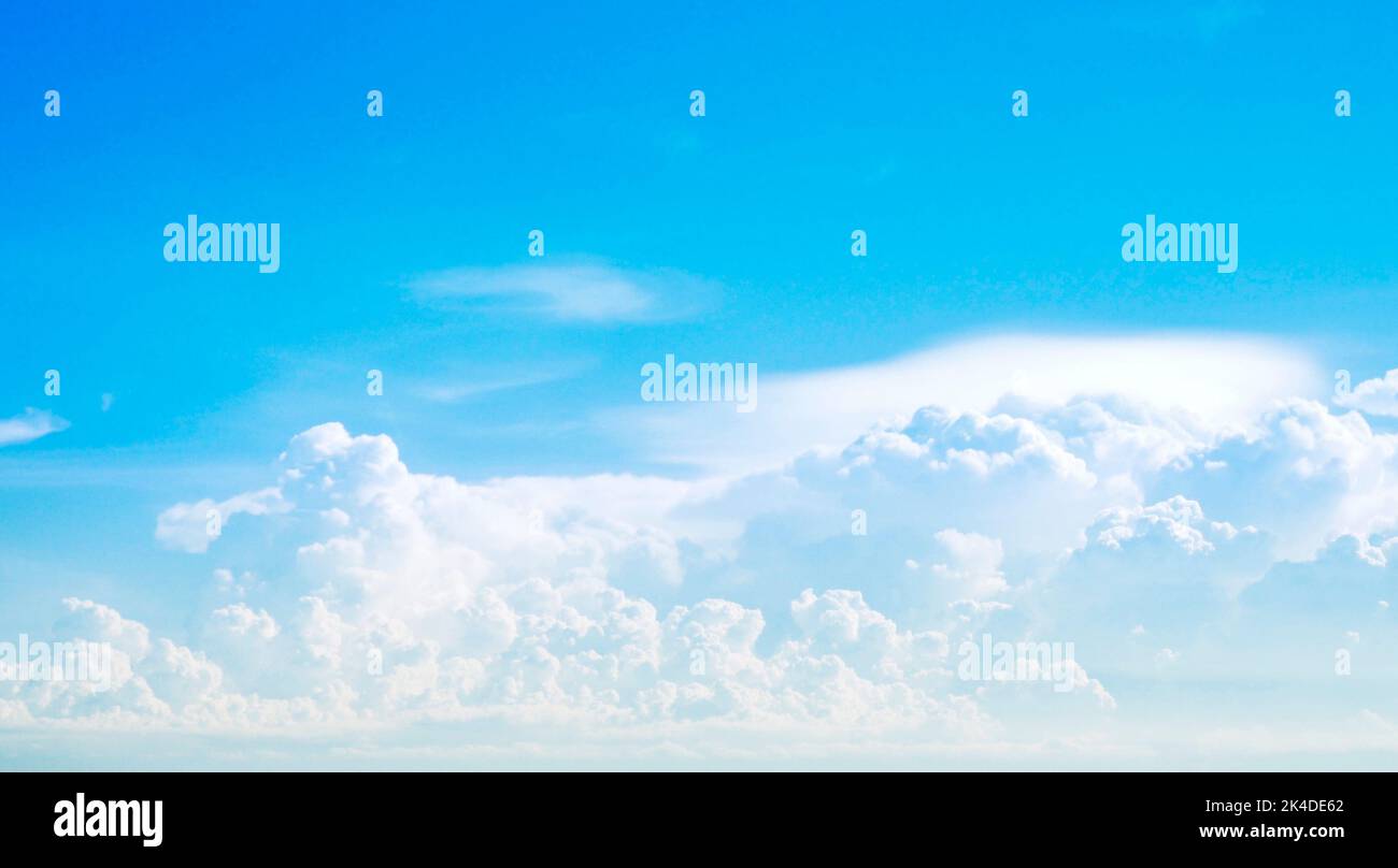 blue Sky white fluffy clouds landscape light background Stock Photo - Alamy