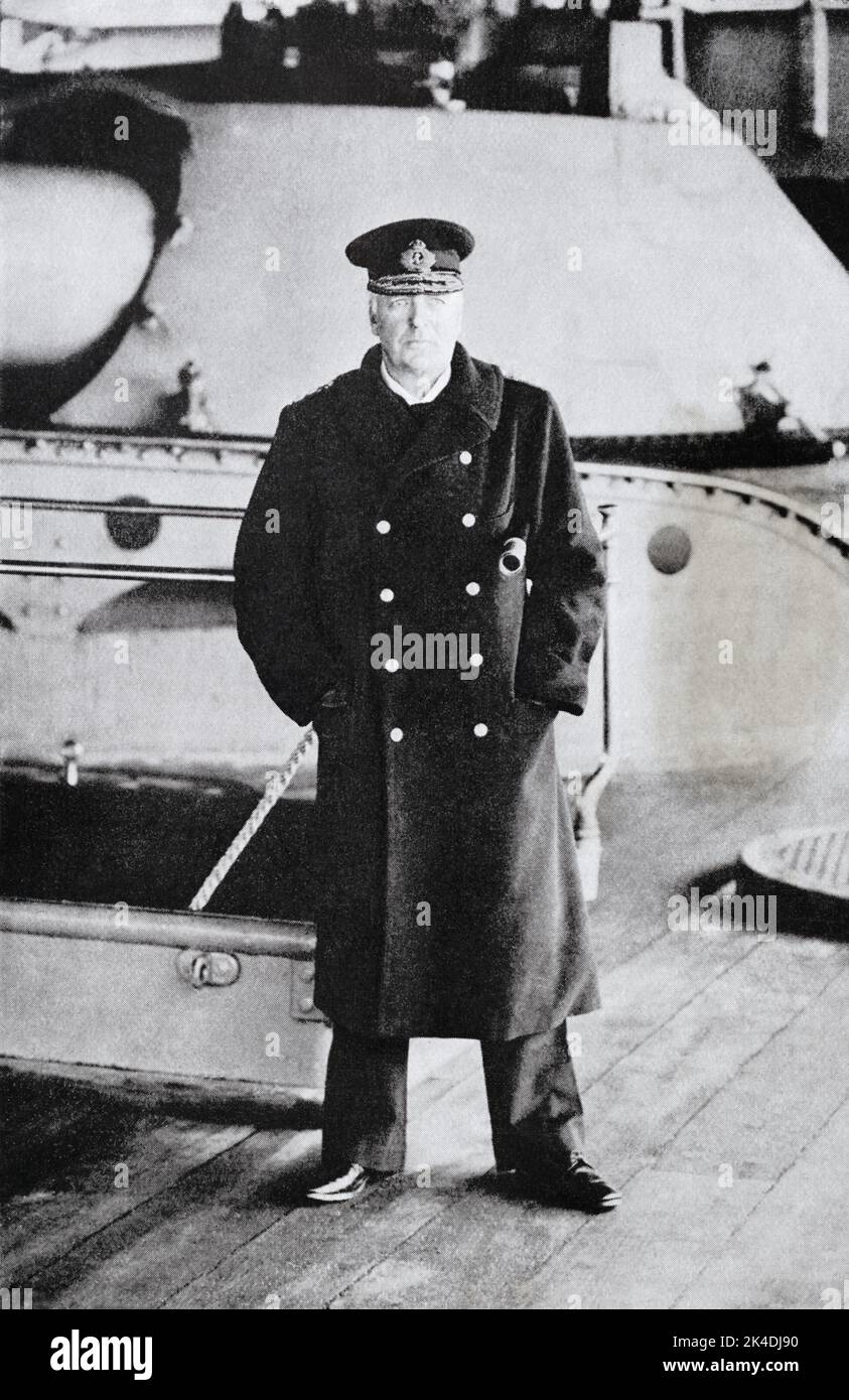 A potrait of Admiral Lord Charles Beresford, GCVO, KCB, c.1907–1909 whilst Commander-in-Chief of the Channel Fleet, standing on deck in front of a large naval gun turret with a telescope under his arm. Stock Photo