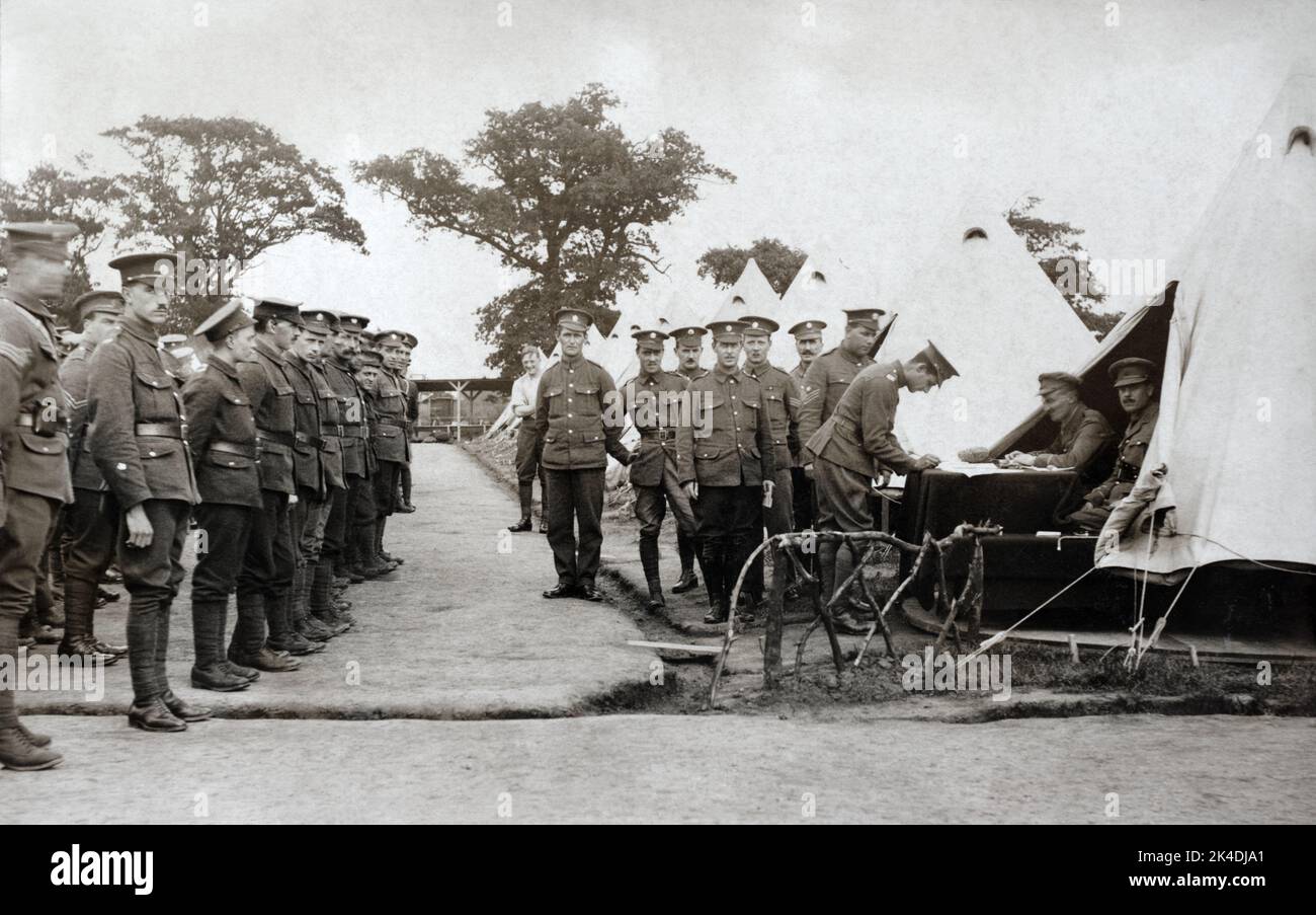 A First World War era picture of British soldiers in the Army Service Corps on a pay parade in camp. Stock Photo