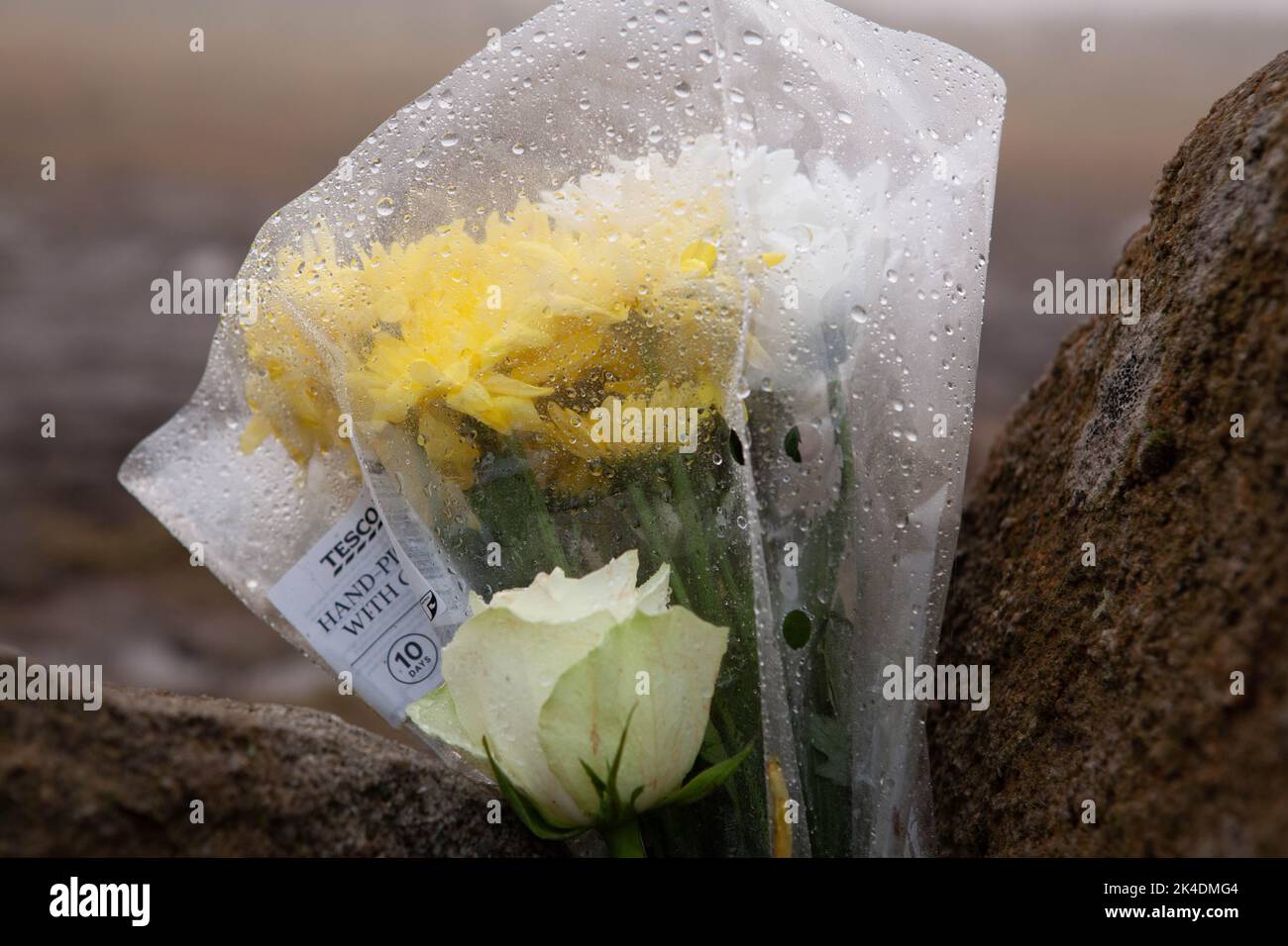 Saddleworth, Oldham, UK. 2nd October, 2022. Floral tribute left by the roadside at the scene of the recent police search for human remains in relation to the Moors Murders Peter Liggins/Alamy Live News Stock Photo