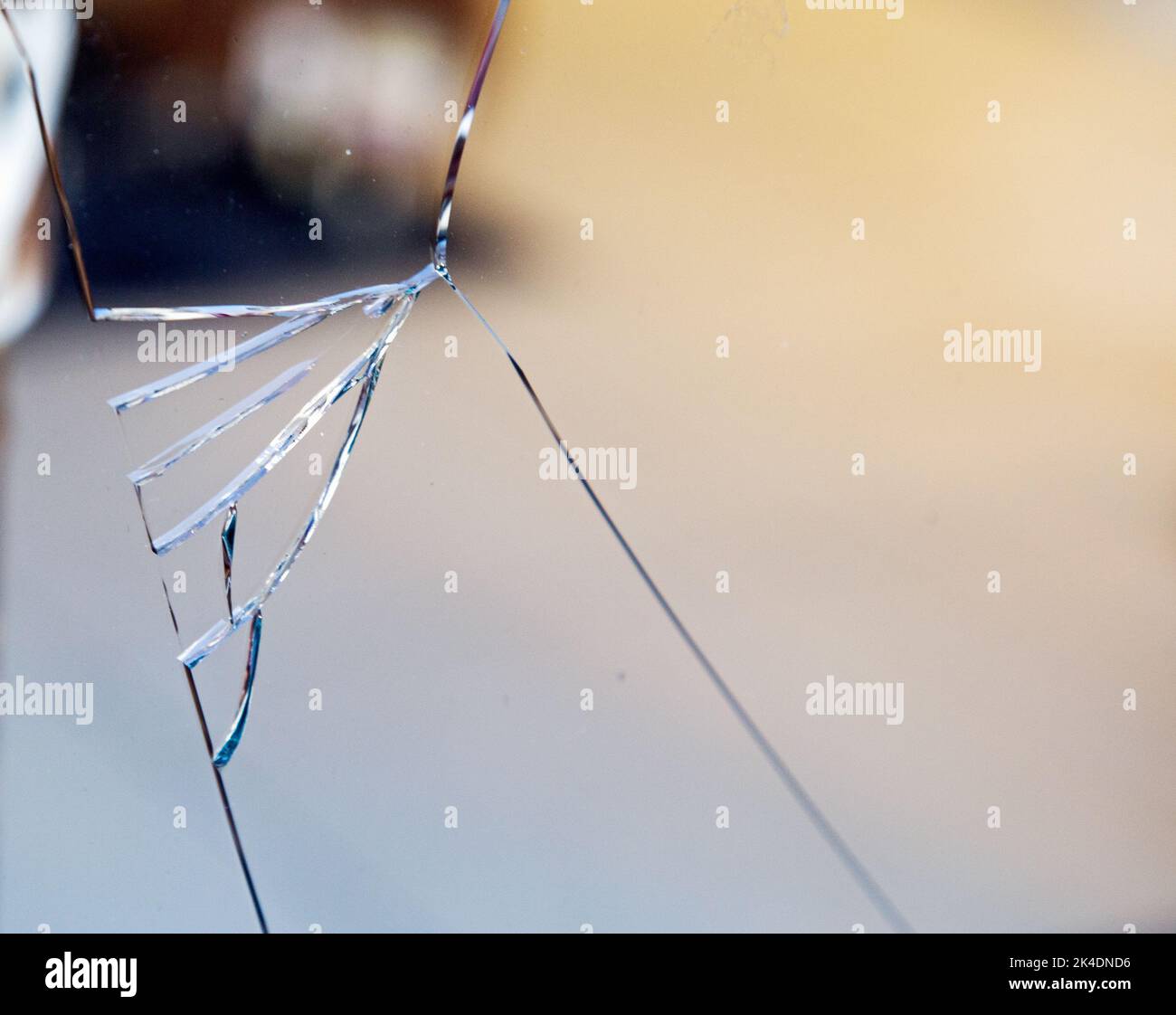 Close up shot of cracks in a glass window Stock Photo