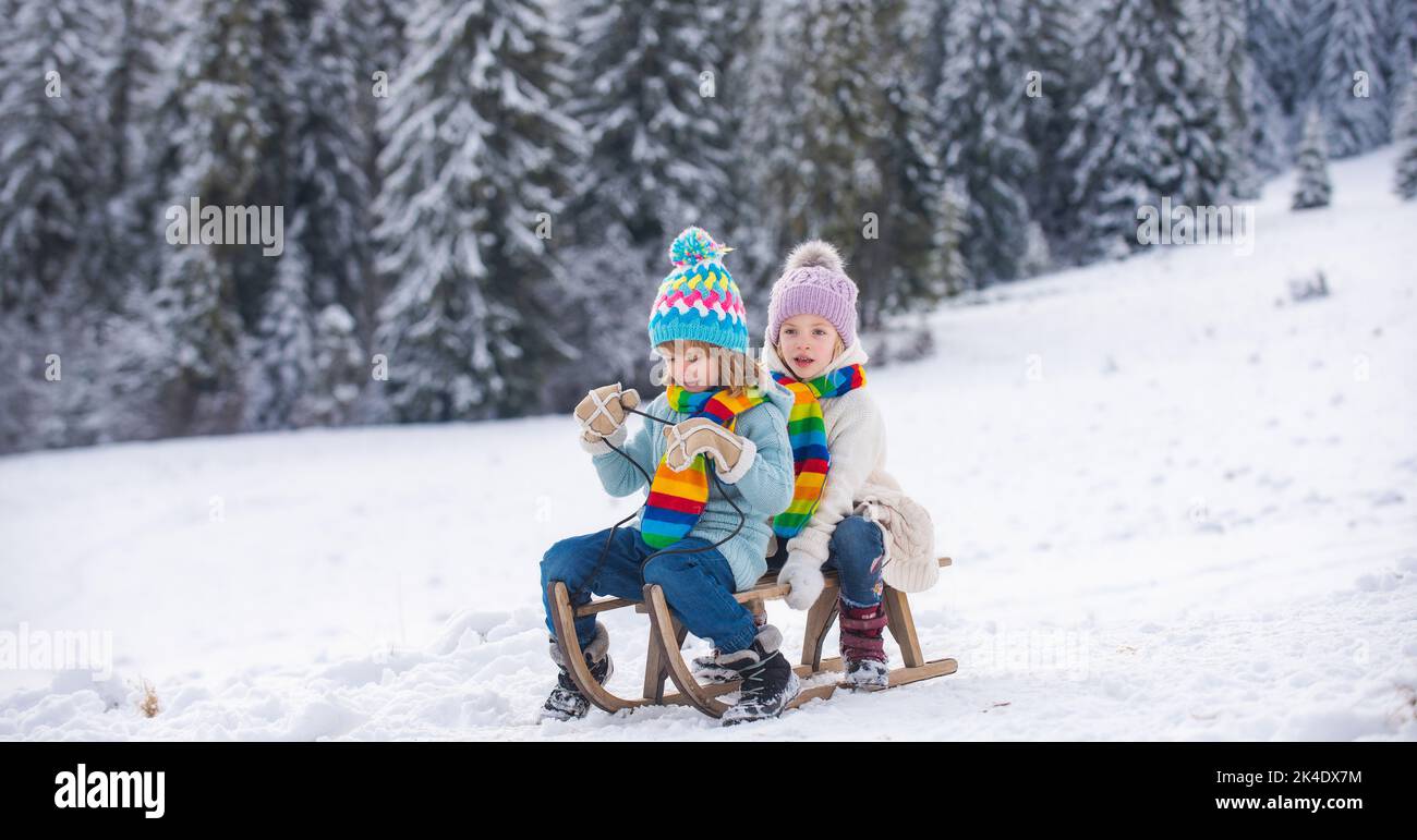 Sled Riding Images Happy little boy and girl sledding in winter. Kids sibling riding on ...