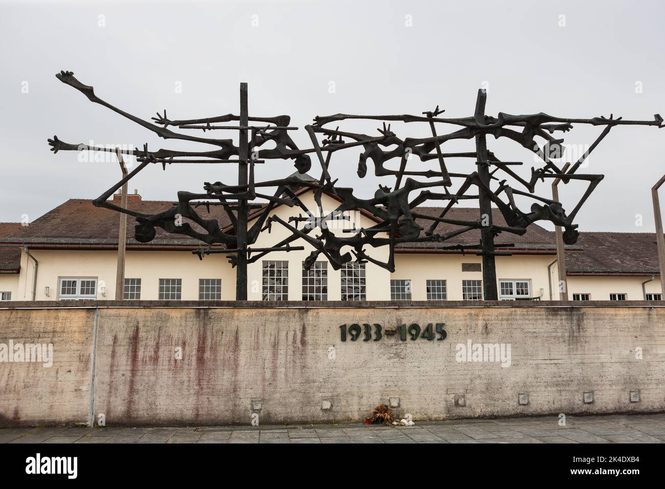 Dachau, Germany - July 4, 2011 : Dachau Concentration Camp Memorial Site. Nazi concentration camp from 1933 to 1945. Memorial wall and sculpture. Stock Photo