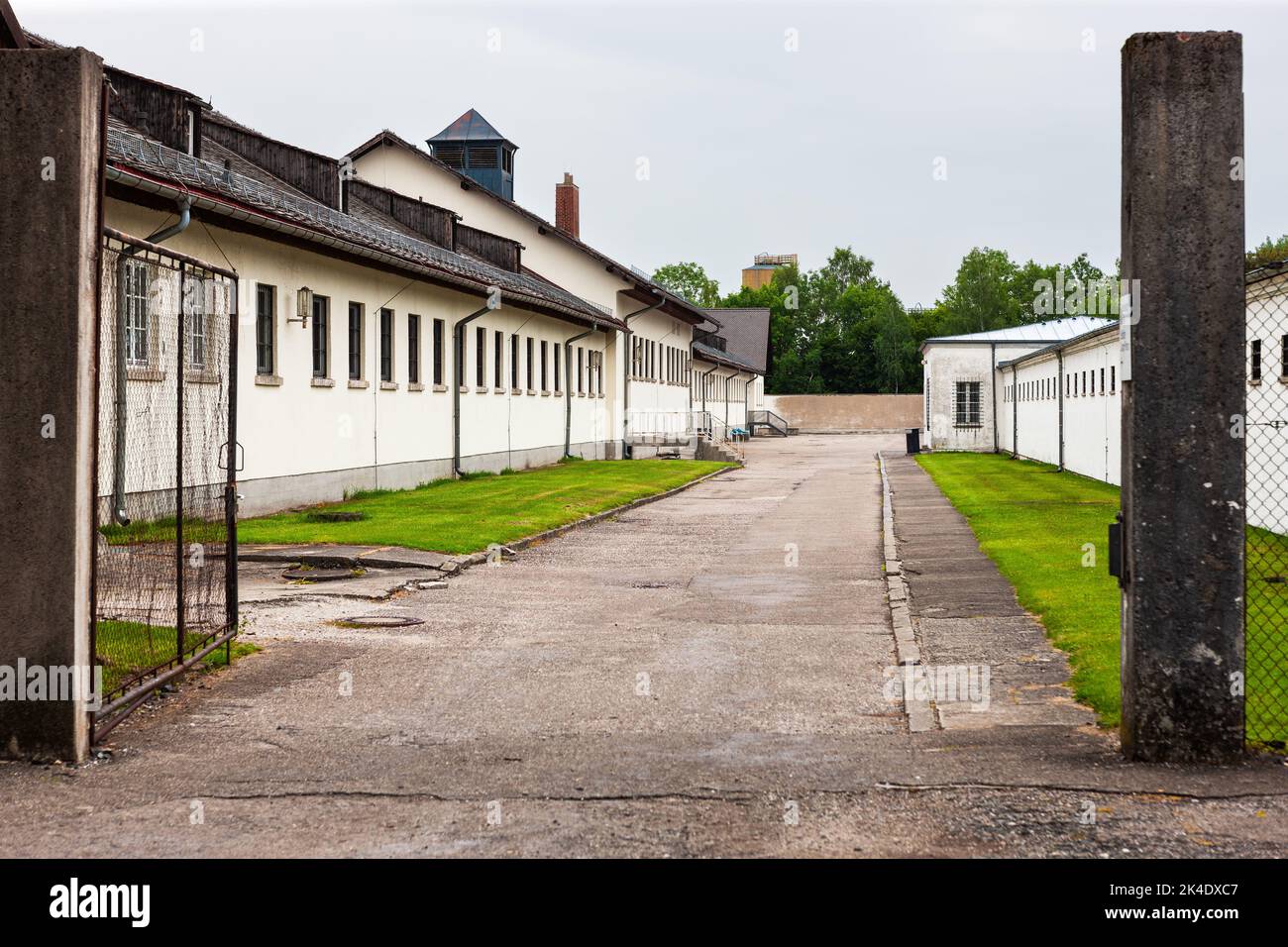 Dachau, Germany - July 4, 2011 : Dachau Concentration Camp Memorial Site. Nazi concentration camp from 1933 to 1945. Gate between two prison cell buil Stock Photo