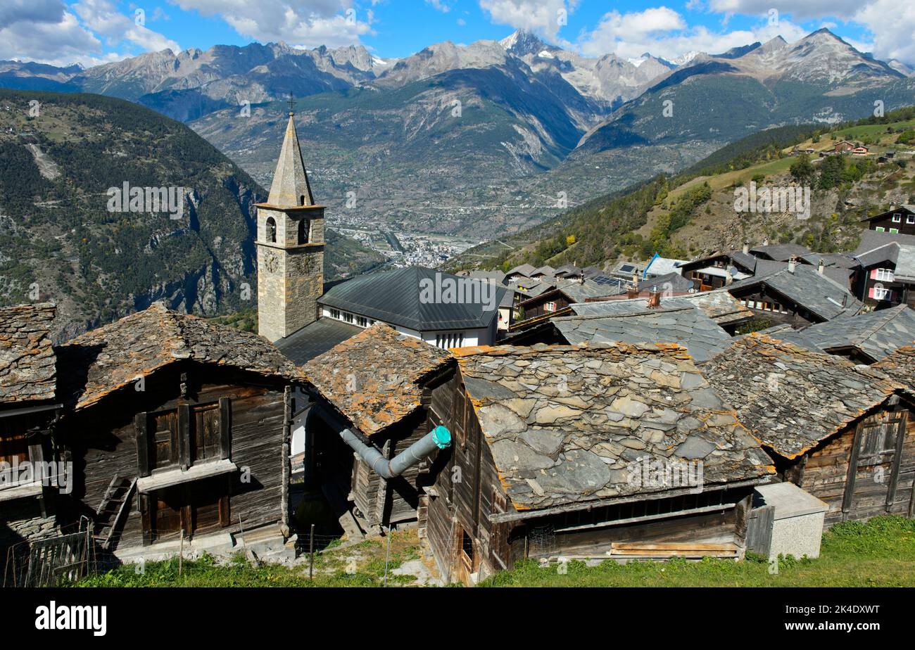 View over the traditional mountain village of Visperterminen to the Rhone Valley with the town of Visp, Heidadorf Visperterminen, Valais, Switzerland Stock Photo