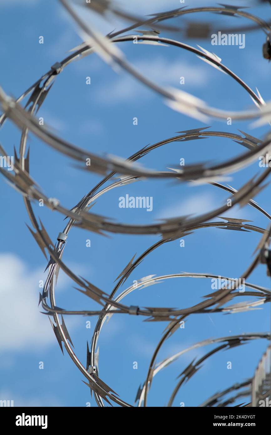 Razor Wire On Top Of A Fence UK Stock Photo