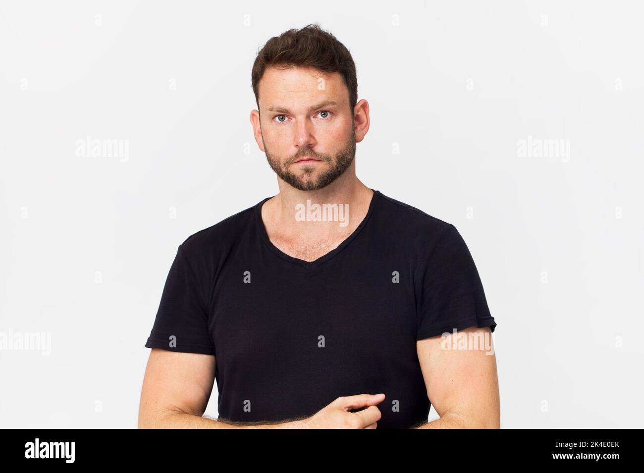 Handsome man in black portrait against white background Stock Photo
