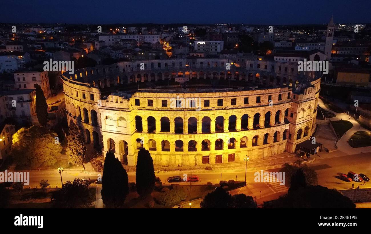 An Aerial View Of The Illuminated Colosseum At Night In Rome Italy An Aerial View Of The Illuminated Colosseum At Night In Rome Italy