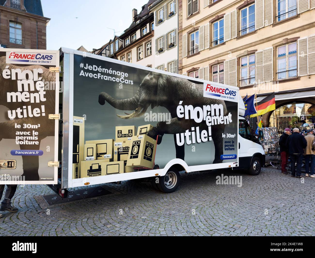 Strasbourg, France Sep 21, 2022: France cars moving relocation services van parked in city cenbter - elephant photograph on the car body Stock Photo
