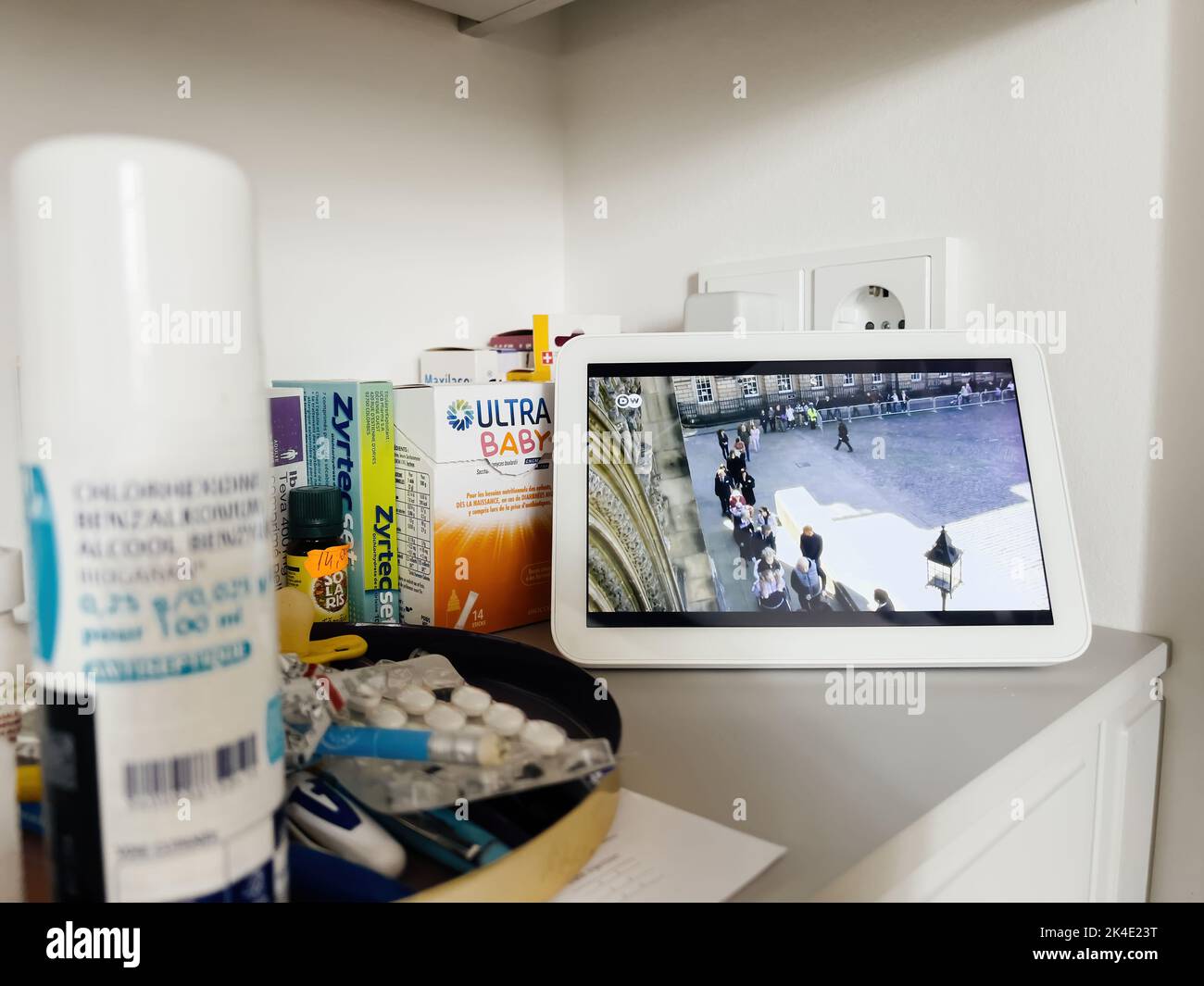 Paris, France - Sep 13, 2022: Kitchen room detail with Amazon Alexa Echo display transmitting live DW Deutsche Well live stream of the funerals of Elizabeth II, Queen of the United Kingdom and the other Commonwealth Stock Photo