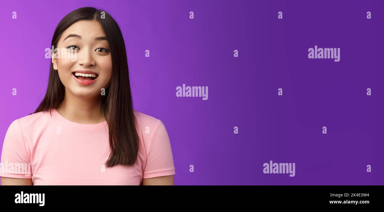 Surprised fascianted cute asian young female raise eyebrows wondered