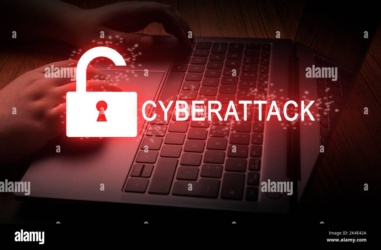 Woman using laptop with digital warning pop up of cyberattack. Cyber crime concept. Cyber security data protection business technology. Stock Photo