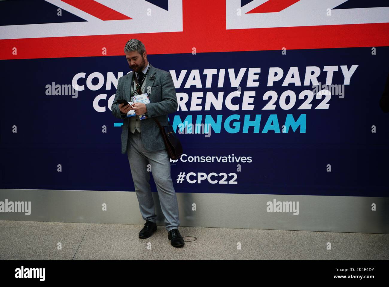A conference delegate attending the Conservative Party annual conference at the International Convention Centre in Birmingham. Picture date: Sunday October 2, 2022. Stock Photo