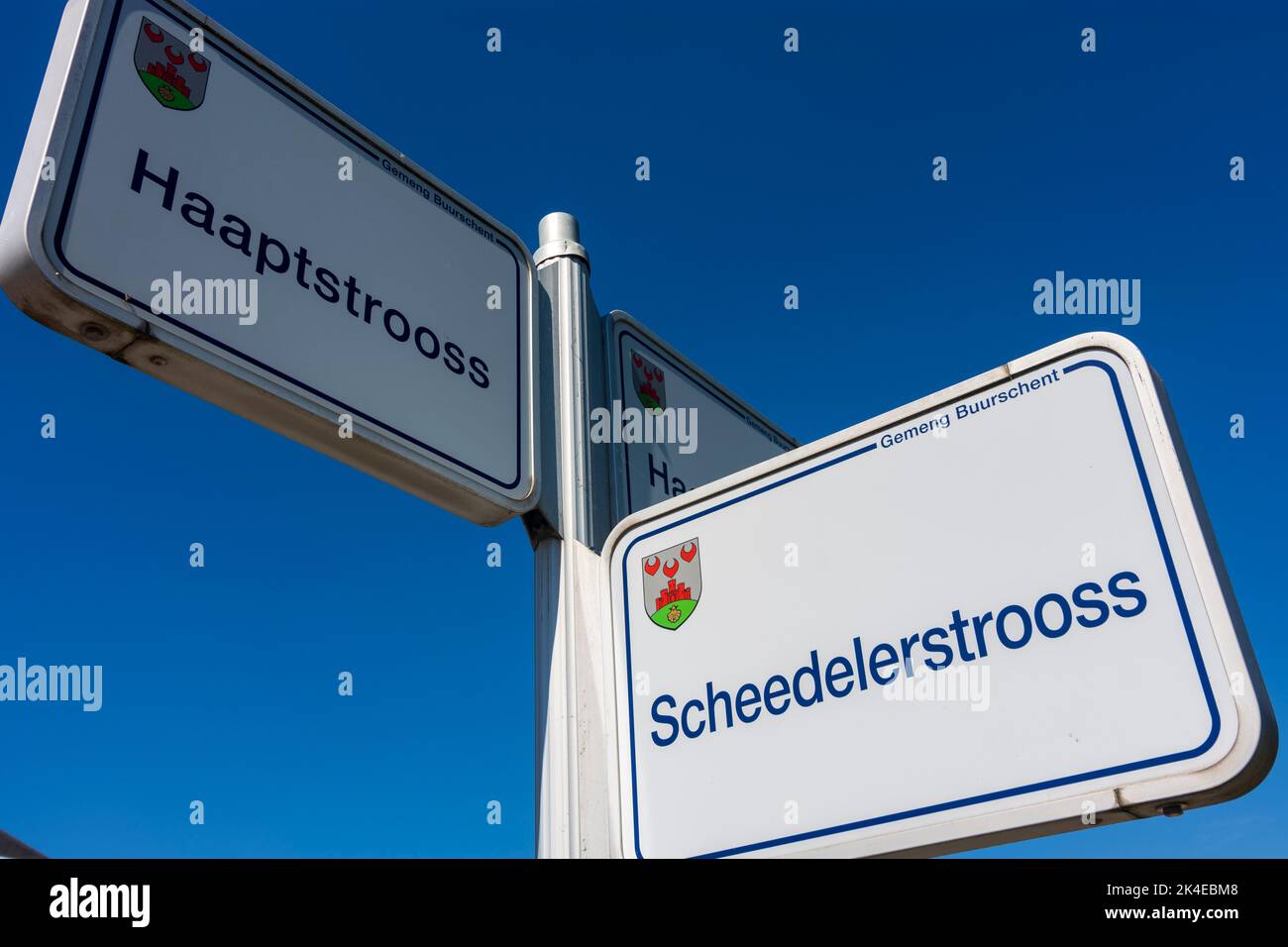 Bourscheid (Buerschent, Burscheid): road name signs in language Luxembourgish in , Luxembourg Stock Photo