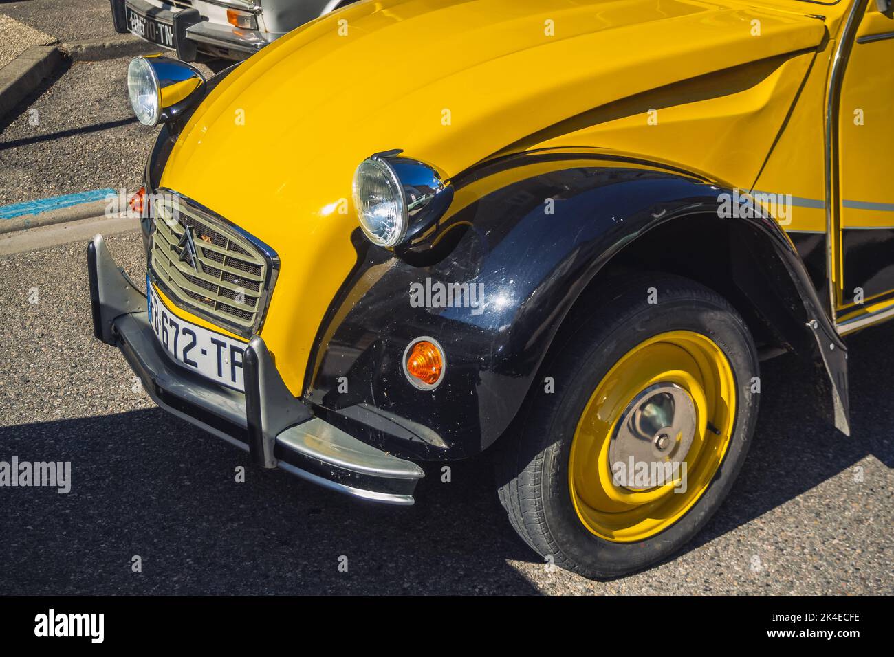 Loriol sur Drome, France - 17 September, 2022: Vintage black and yellow Citroen 2cv6 Charleston, on the street. Classic car. Stock Photo