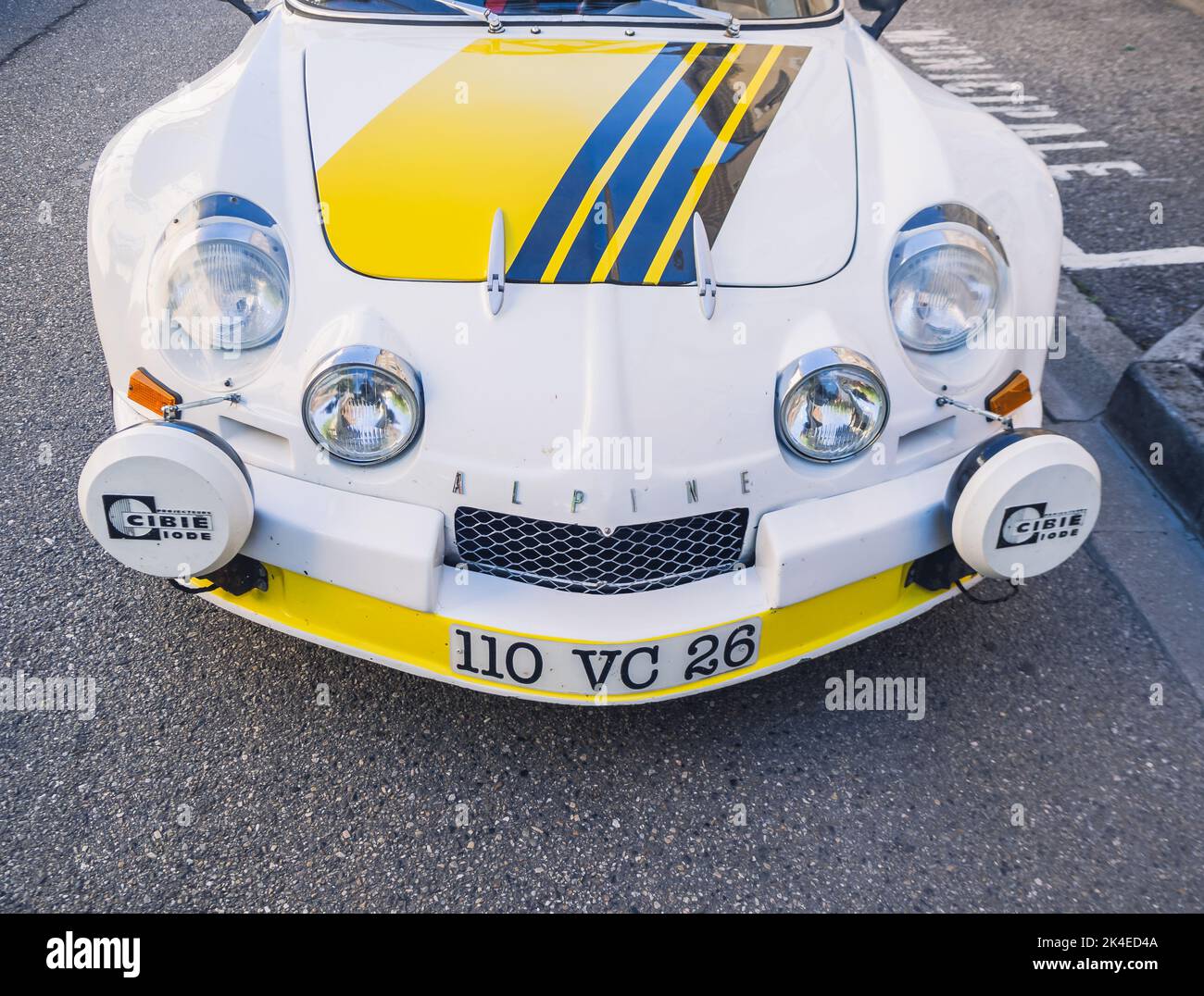 Loriol sur Drome, France - 17 September, 2022: Vintage renault alpine berlinette 1300. Old white and yellow racing car parked on the street Stock Photo