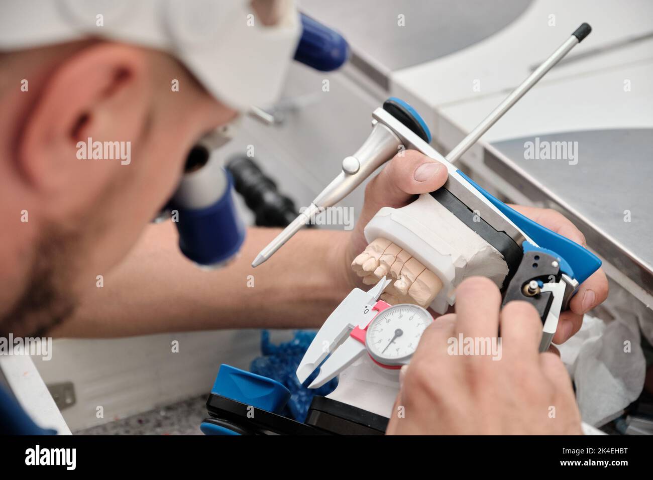 Orthodontic, dental technician working on false teeth. Dental