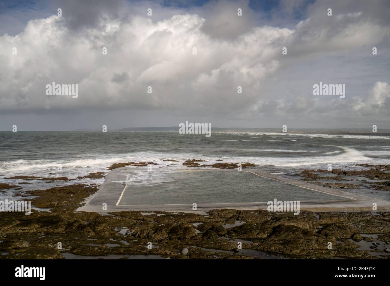 Sea water outdoor pool at Westward Ho, on the Devon coast of England, in winter. No people. Stock Photo