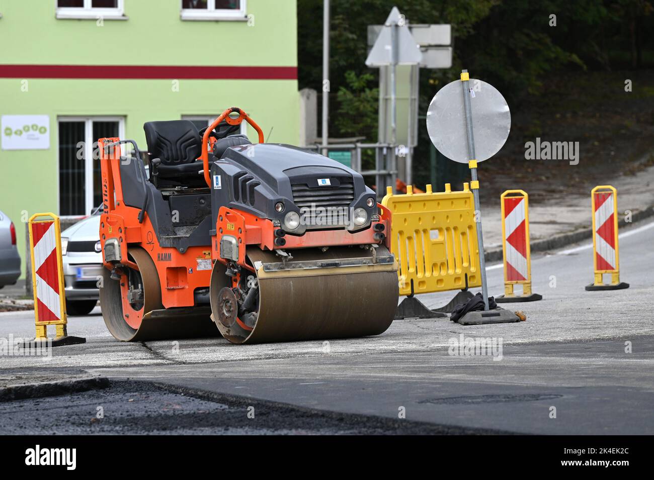 A road roller paving a street Stock Photo