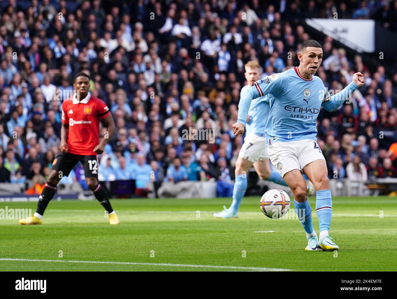 Manchester City's Phil Foden (right) scores their side's first goal of