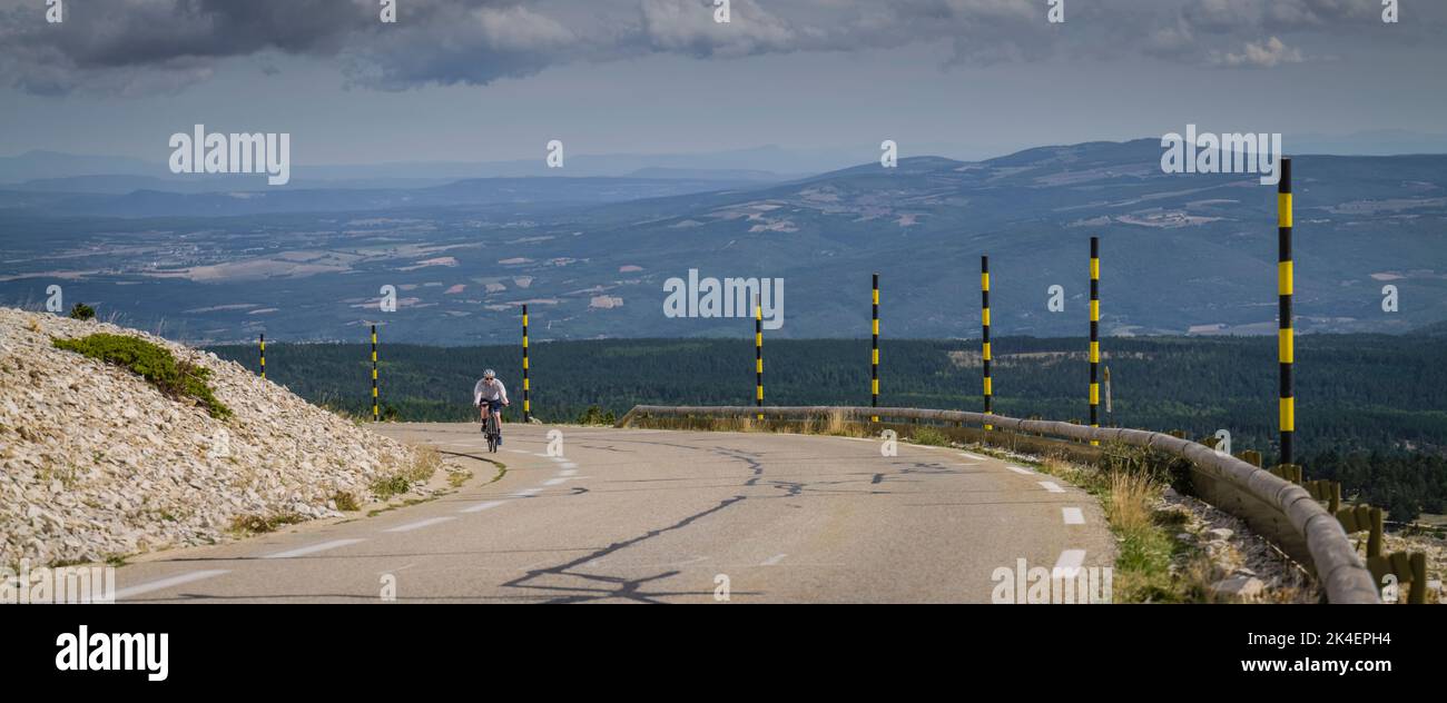 Panoramic image of a female road cyclist riding the classic climb of Mont Ventoux, Provence, France. Stock Photo