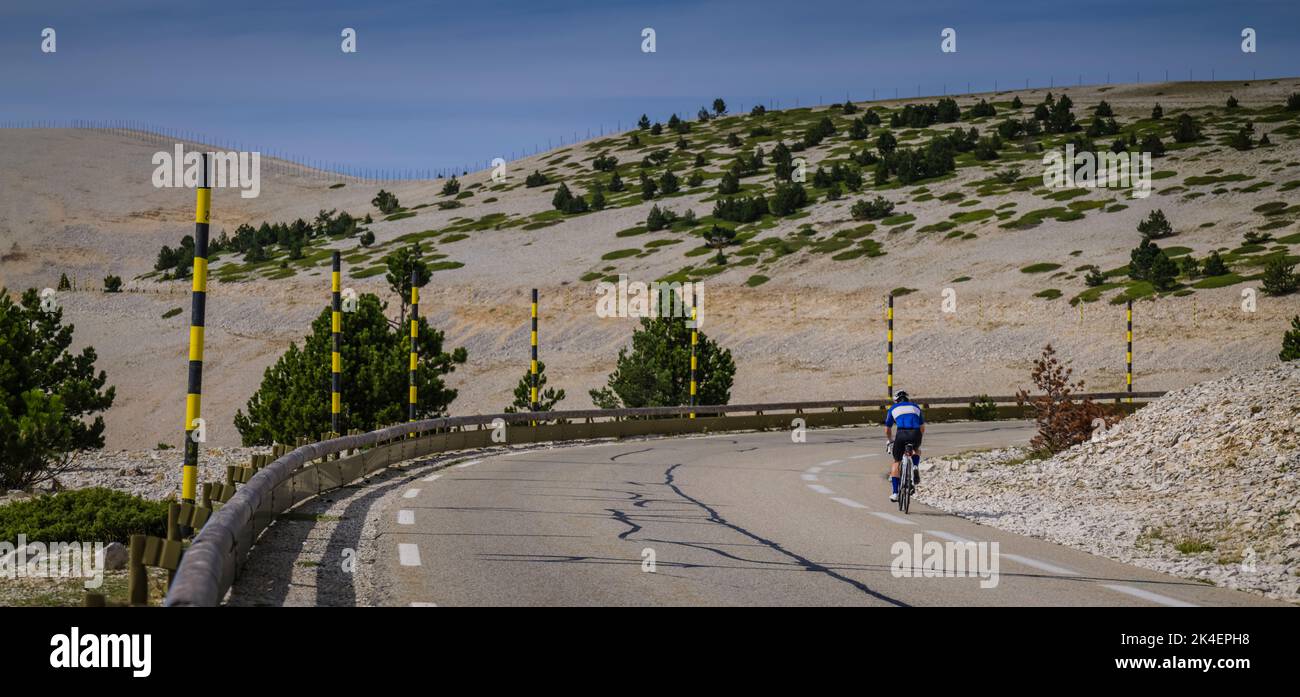 Panoramic image of a male road cyclist riding the classic climb of Mont Ventoux, Provence, France. Stock Photo