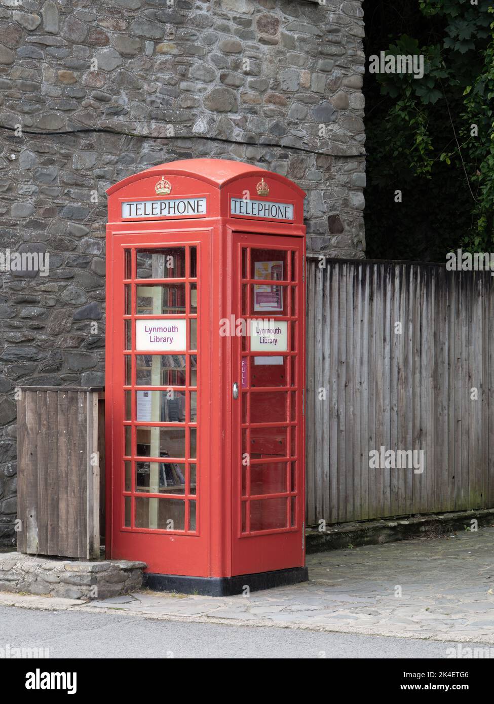 LYNMOUTH, DEVON, SEPTEMBER 11 2022: Lynmouth library in a repurposed old red phone box. Stock Photo