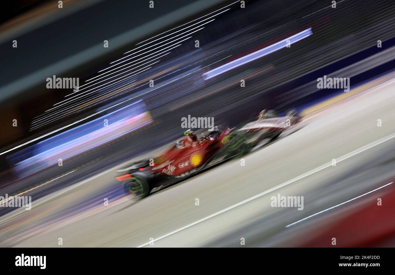 Formula One F1 - Singapore Grand Prix - Marina Bay Street Circuit, Singapore - October 2, 2022 Ferrari's Carlos Sainz Jr. in action during the race REUTERS/Edgar Su Stock Photo