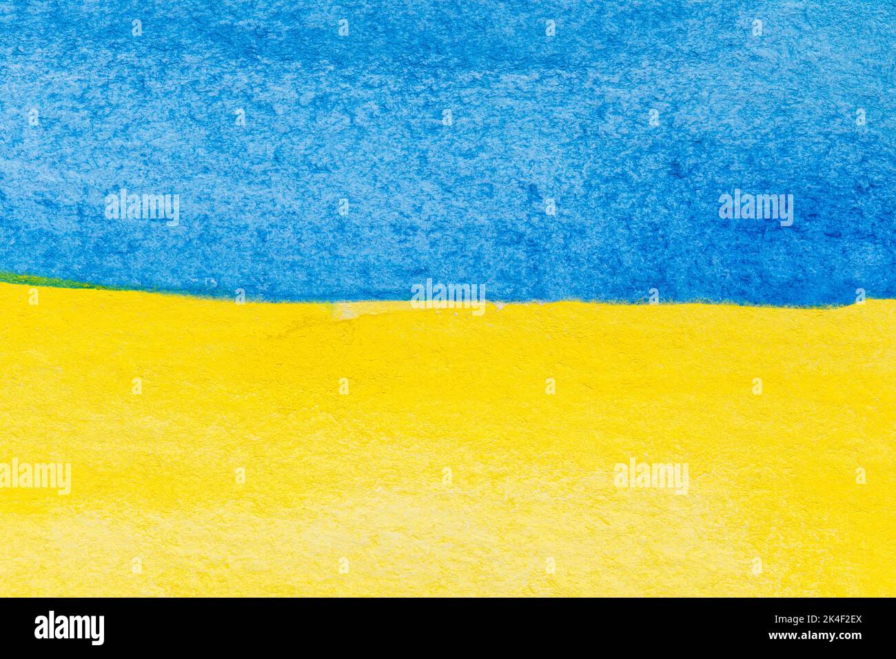 Flag of Ukraine painted with watercolors. Macro close-up of blue and yellow watercolour painting. Textured aquarelle paper background with copy space. Stock Photo