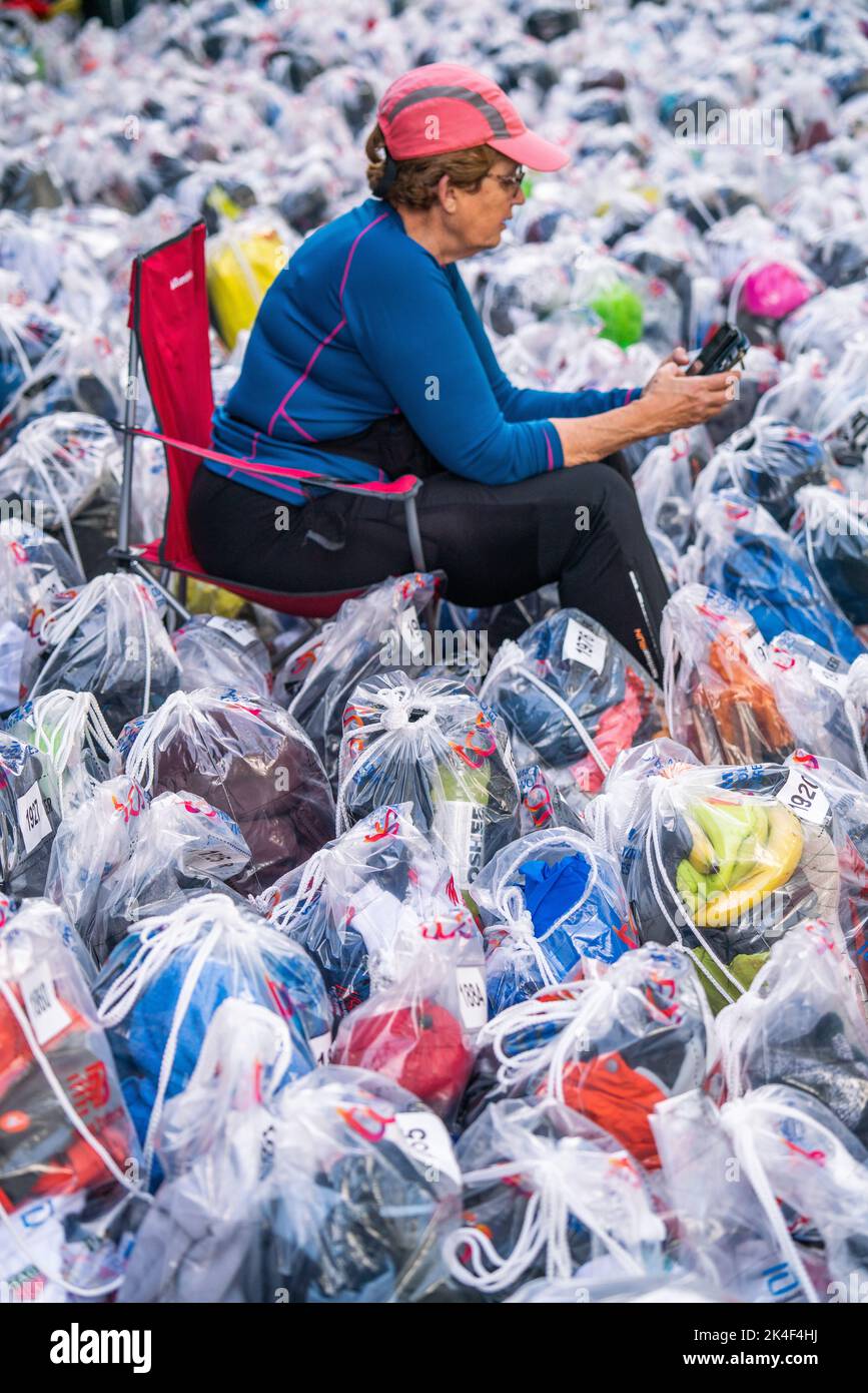 London UK. 2 October 2022 .  Thousands of baggage  belonging to marathon runners are tagged and numbered at The Mall for collection after the race  as more than  40,000 participants including elite runners took part in the London Marathon over a 26.2 mile course. than Credit: amer ghazzal/Alamy Live News. Stock Photo
