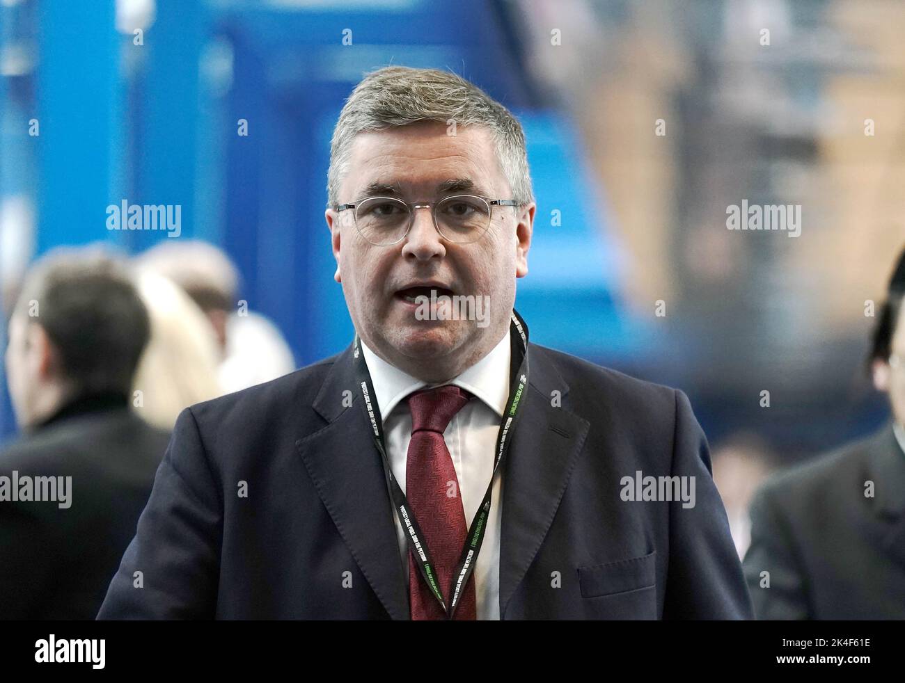 Secretary of State for Wales Robert Buckland, walks across the Hyatt hotel bridge at the Conservative Party annual conference at the International Convention Centre in Birmingham. Picture date: Sunday October 2, 2022. Stock Photo
